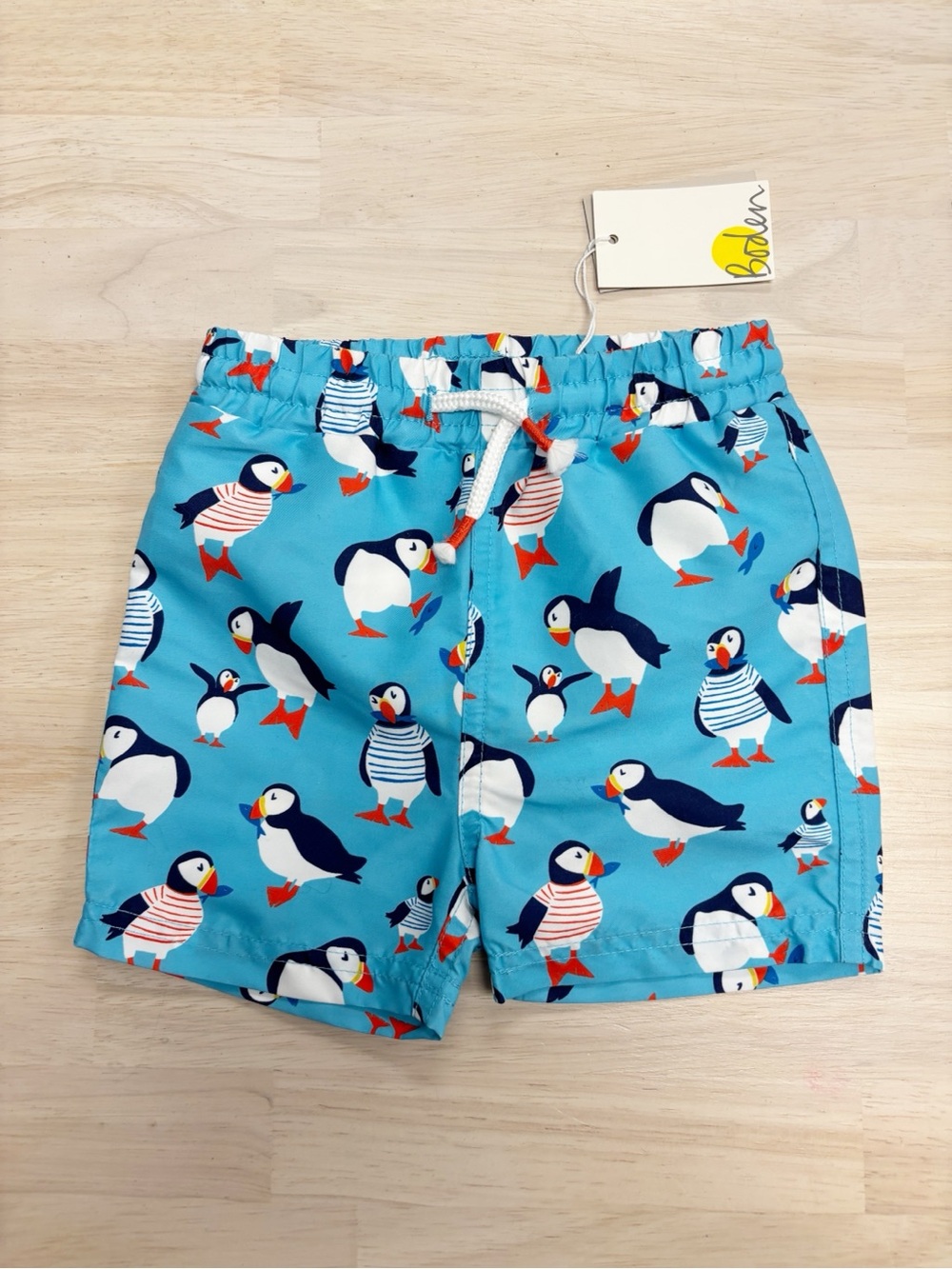 New Baby Boden puffin swim trunks